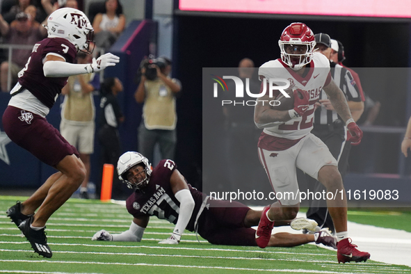 Arkansas Razorbacks running back Ja'Quinden Jackson #22 rushes with the ball against the Texas A&M Aggies during the Southwest Classic match...