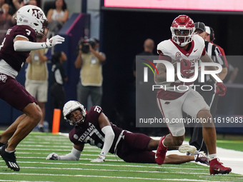 Arkansas Razorbacks running back Ja'Quinden Jackson #22 rushes with the ball against the Texas A&M Aggies during the Southwest Classic match...