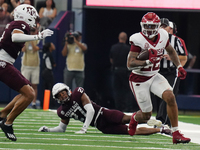 Arkansas Razorbacks running back Ja'Quinden Jackson #22 rushes with the ball against the Texas A&M Aggies during the Southwest Classic match...