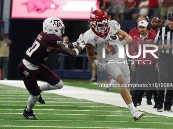 Arkansas Razorbacks wide receiver Isaac TeSlaa #4 rushes with the ball against the Texas A&M Aggies during the Southwest Classic match betwe...