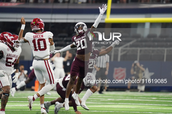 Arkansas Razorbacks quarterback Taylen Green #10 passes the ball against Texas A&M Aggies during the Southwest Classic match between the Ark...