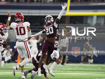 Arkansas Razorbacks quarterback Taylen Green #10 passes the ball against Texas A&M Aggies during the Southwest Classic match between the Ark...