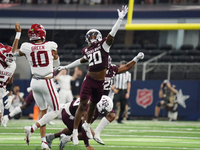 Arkansas Razorbacks quarterback Taylen Green #10 passes the ball against Texas A&M Aggies during the Southwest Classic match between the Ark...