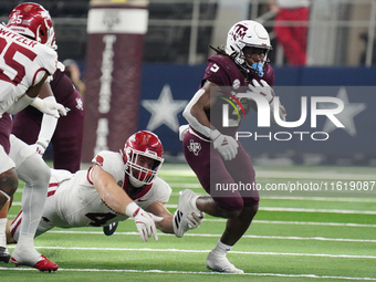 Texas A&M Aggies running back Amari Daniels #5 rushes with the ball against the Arkansas Razorbacks during the Southwest Classic match betwe...