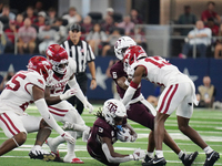 Texas A&M Aggies running back Amari Daniels #5 rushes with the ball against the Arkansas Razorbacks during the Southwest Classic match betwe...