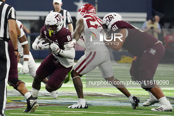 Texas A&M Aggies running back Le'Veon Moss #8 runs with the ball against the Arkansas Razorbacks during the Southwest Classic match between...