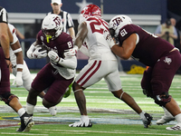 Texas A&M Aggies running back Le'Veon Moss #8 runs with the ball against the Arkansas Razorbacks during the Southwest Classic match between...