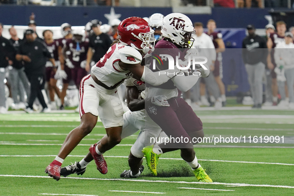 Texas A&M Aggies running back Le'Veon Moss #8 runs with the ball against the Arkansas Razorbacks during the Southwest Classic match between...