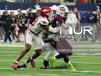 Texas A&M Aggies running back Le'Veon Moss #8 runs with the ball against the Arkansas Razorbacks during the Southwest Classic match between...