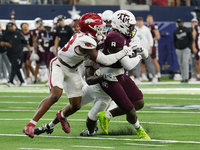 Texas A&M Aggies running back Le'Veon Moss #8 runs with the ball against the Arkansas Razorbacks during the Southwest Classic match between...