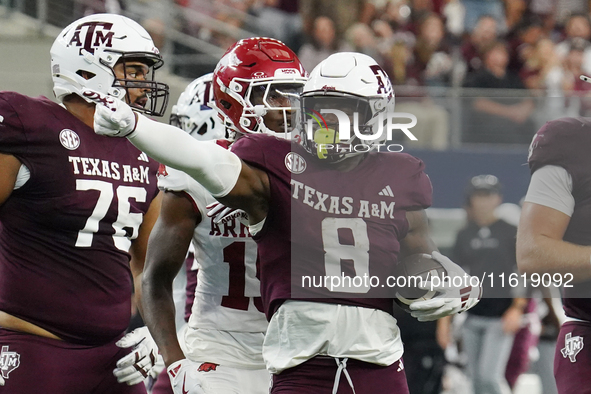 Texas A&M Aggies running back Le'Veon Moss #8 celebrates against the Arkansas Razorbacks during the Southwest Classic match between the Arka...