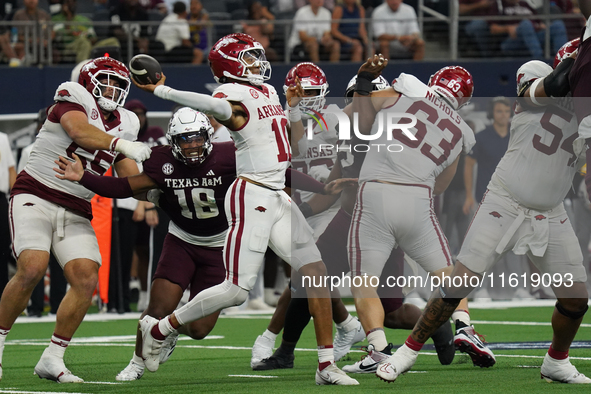 Arkansas Razorbacks quarterback Taylen Green #10 passes the ball against Texas A&M Aggies during the Southwest Classic match between the Ark...