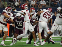 Arkansas Razorbacks quarterback Taylen Green #10 passes the ball against Texas A&M Aggies during the Southwest Classic match between the Ark...