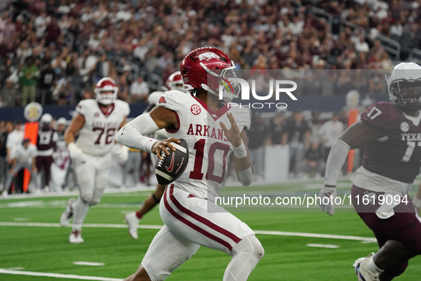 Arkansas Razorbacks quarterback Taylen Green #10 rushes with the ball against Texas A&M Aggies during the Southwest Classic match between th...