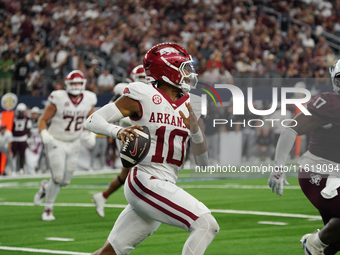 Arkansas Razorbacks quarterback Taylen Green #10 rushes with the ball against Texas A&M Aggies during the Southwest Classic match between th...