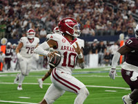 Arkansas Razorbacks quarterback Taylen Green #10 rushes with the ball against Texas A&M Aggies during the Southwest Classic match between th...