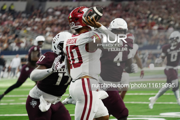 Arkansas Razorbacks quarterback Taylen Green #10 passes the ball against Texas A&M Aggies during the Southwest Classic match between the Ark...