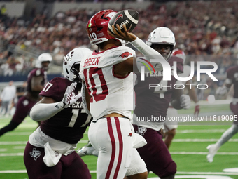 Arkansas Razorbacks quarterback Taylen Green #10 passes the ball against Texas A&M Aggies during the Southwest Classic match between the Ark...