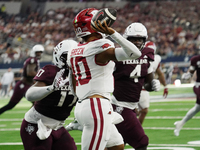 Arkansas Razorbacks quarterback Taylen Green #10 passes the ball against Texas A&M Aggies during the Southwest Classic match between the Ark...