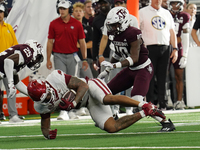 Arkansas Razorbacks running back Ja'Quinden Jackson #22 catches the ball against the Texas A&M Aggies during the Southwest Classic match bet...