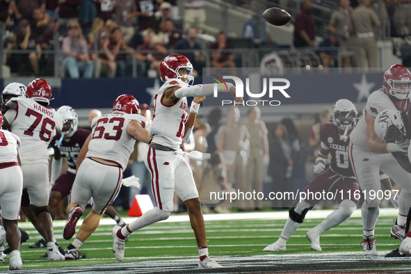 Arkansas Razorbacks quarterback Taylen Green #10 passes the ball against Texas A&M Aggies during the Southwest Classic match between the Ark...