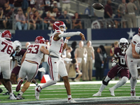 Arkansas Razorbacks quarterback Taylen Green #10 passes the ball against Texas A&M Aggies during the Southwest Classic match between the Ark...