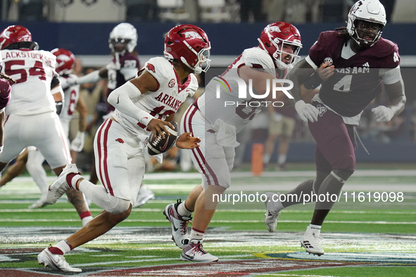 Arkansas Razorbacks quarterback Taylen Green #10 rushes with the ball against Texas A&M Aggies during the Southwest Classic match between th...