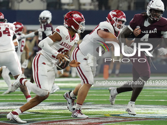 Arkansas Razorbacks quarterback Taylen Green #10 rushes with the ball against Texas A&M Aggies during the Southwest Classic match between th...