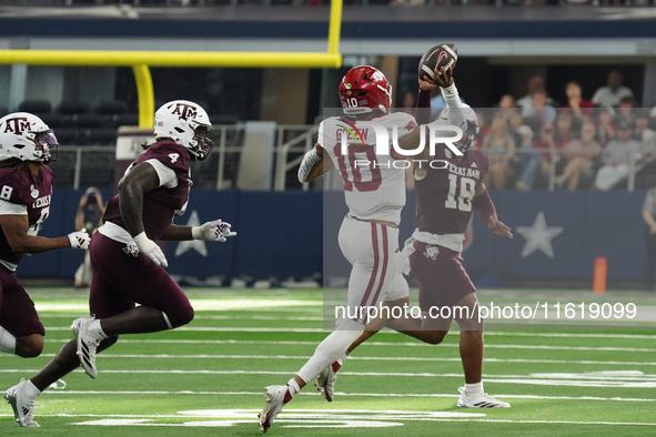 Arkansas Razorbacks quarterback Taylen Green #10 passes the ball against Texas A&M Aggies during the Southwest Classic match between the Ark...