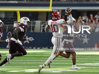 Arkansas Razorbacks quarterback Taylen Green #10 passes the ball against Texas A&M Aggies during the Southwest Classic match between the Ark...