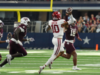 Arkansas Razorbacks quarterback Taylen Green #10 passes the ball against Texas A&M Aggies during the Southwest Classic match between the Ark...