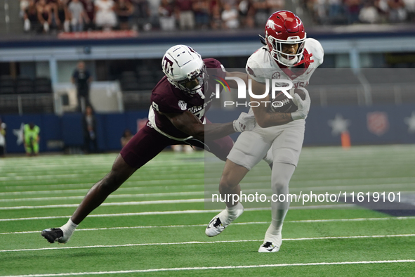 Arkansas Razorbacks Wide Receiver Isaiah Sategna #6 catches the ball against Texas A&M Razorbacks during the Southwest Classic match between...