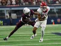 Arkansas Razorbacks Wide Receiver Isaiah Sategna #6 catches the ball against Texas A&M Razorbacks during the Southwest Classic match between...