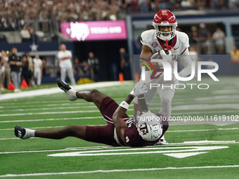 Arkansas Razorbacks Wide Receiver Isaiah Sategna #6 catches the ball against Texas A&M Razorbacks during the Southwest Classic match between...