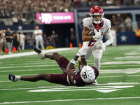 Arkansas Razorbacks Wide Receiver Isaiah Sategna #6 catches the ball against Texas A&M Razorbacks during the Southwest Classic match between...