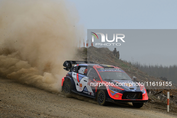 Driver Thierry Neuville and co-driver Martijn Wydaeghe of the Hyundai Shell Mobis World Rally Team, in a Hyundai i20 N Rally1 Hybrid, face t...