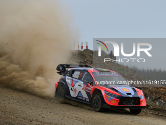 Driver Thierry Neuville and co-driver Martijn Wydaeghe of the Hyundai Shell Mobis World Rally Team, in a Hyundai i20 N Rally1 Hybrid, face t...