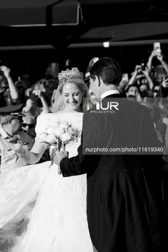 Princess Theodora Glucksburg of Greece and her brother Pavlos, former Crown Prince of Greece, arrive for her wedding with Matthew Jeremiah K...