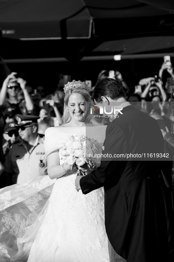 Princess Theodora Glucksburg of Greece and her brother Pavlos, former Crown Prince of Greece, arrive for her wedding with Matthew Jeremiah K...