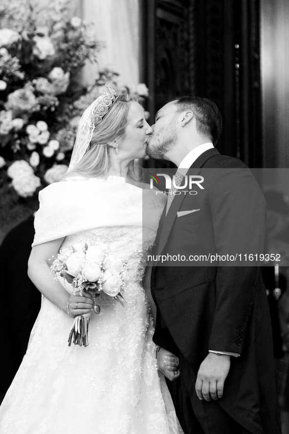 Princess Theodora Glucksburg of Greece and Matthew Jeremiah Kumar kiss each other after their wedding at the Metropolitan Cathedral in Athen...