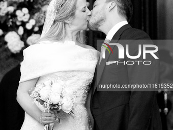 Princess Theodora Glucksburg of Greece and Matthew Jeremiah Kumar kiss each other after their wedding at the Metropolitan Cathedral in Athen...