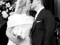 Princess Theodora Glucksburg of Greece and Matthew Jeremiah Kumar kiss each other after their wedding at the Metropolitan Cathedral in Athen...