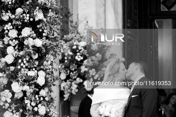 Princess Theodora Glucksburg of Greece and Matthew Jeremiah Kumar kiss each other after their wedding at the Metropolitan Cathedral in Athen...