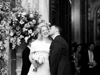 Matthew Jeremiah Kumar kisses Princess Theodora Glucksburg of Greece on her neck after their wedding at the Metropolitan Cathedral in Athens...