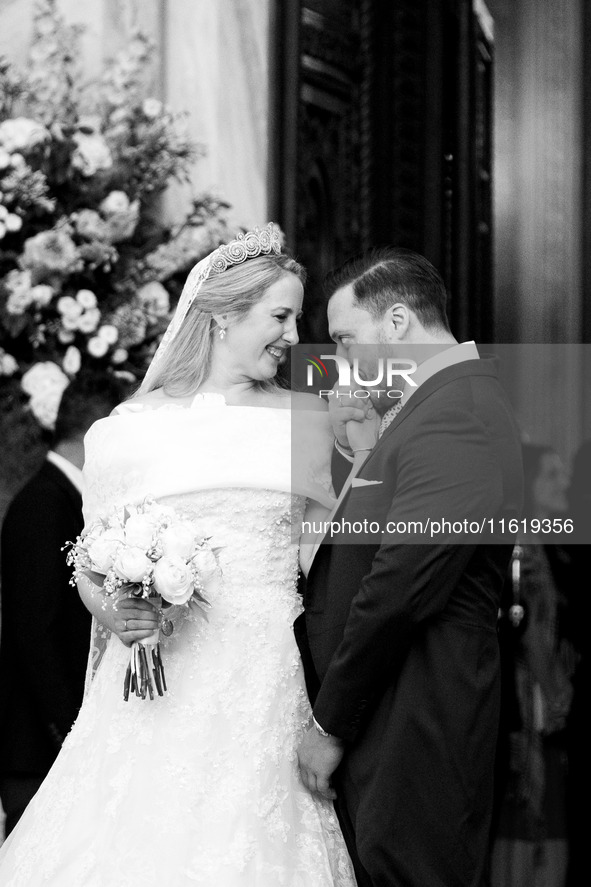 Matthew Jeremiah Kumar kisses the hand of Princess Theodora Glucksburg of Greece after their wedding at the Metropolitan Cathedral in Athens...