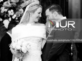 Matthew Jeremiah Kumar kisses the hand of Princess Theodora Glucksburg of Greece after their wedding at the Metropolitan Cathedral in Athens...