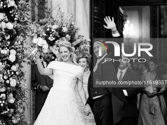 Princess Theodora Glucksburg of Greece and Matthew Jeremiah Kumar greet after their wedding at the Metropolitan Cathedral in Athens, Greece,...