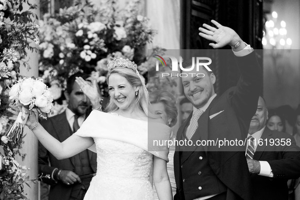 Princess Theodora Glucksburg of Greece and Matthew Jeremiah Kumar greet after their wedding at the Metropolitan Cathedral in Athens, Greece,...