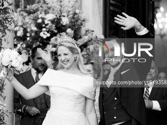 Princess Theodora Glucksburg of Greece and Matthew Jeremiah Kumar greet after their wedding at the Metropolitan Cathedral in Athens, Greece,...