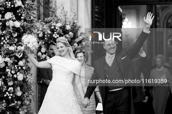 Princess Theodora Glucksburg of Greece and Matthew Jeremiah Kumar greet after their wedding at the Metropolitan Cathedral in Athens, Greece,...